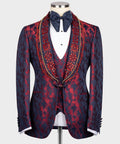 Navy tuxedo jacket with red patterned lapels, white shirt, navy bow tie