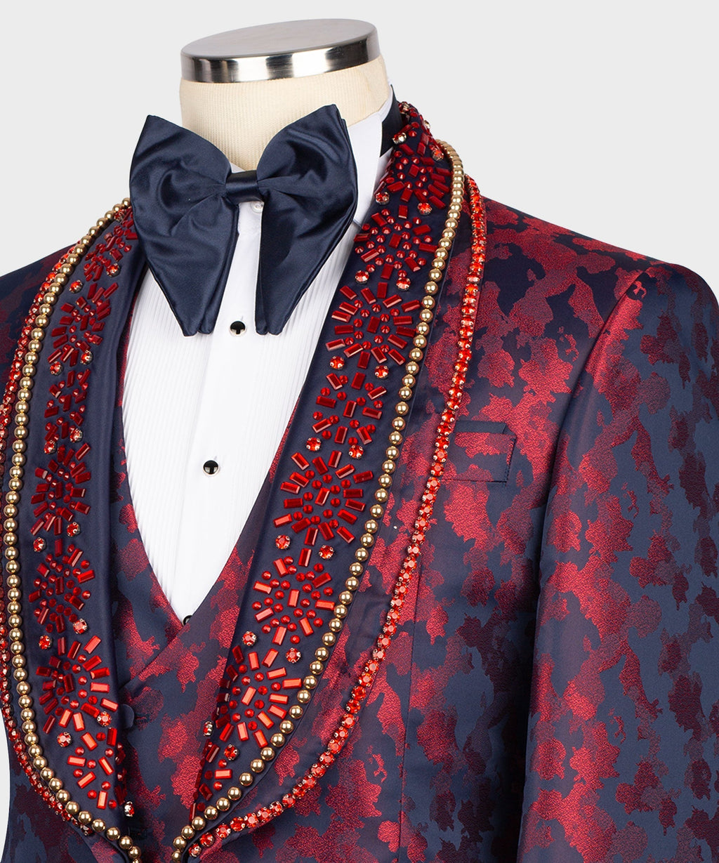 Close-up navy tuxedo jacket with red pattern, gold beaded trim, navy bow tie