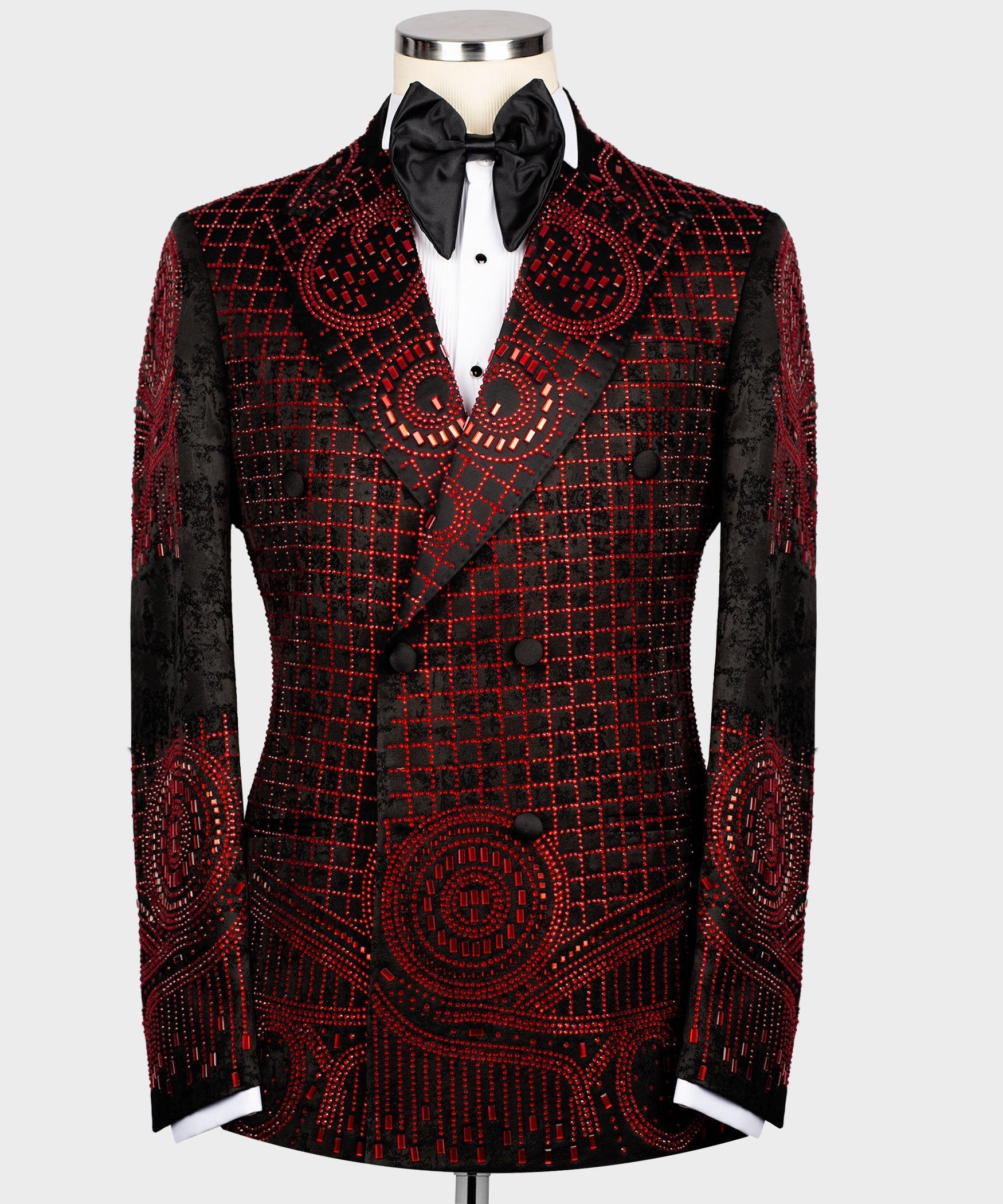 Black tuxedo jacket with red embroidered grid and swirl detailing, satin bow tie.