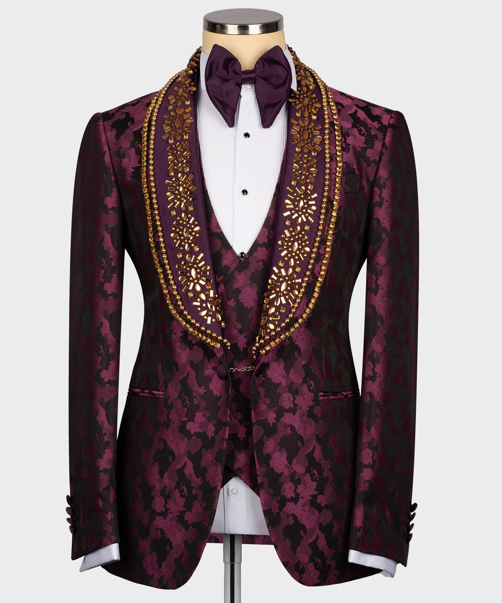 Stone-embellished tuxedo jacket with bow tie, white shirt, gold trim on burgundy print