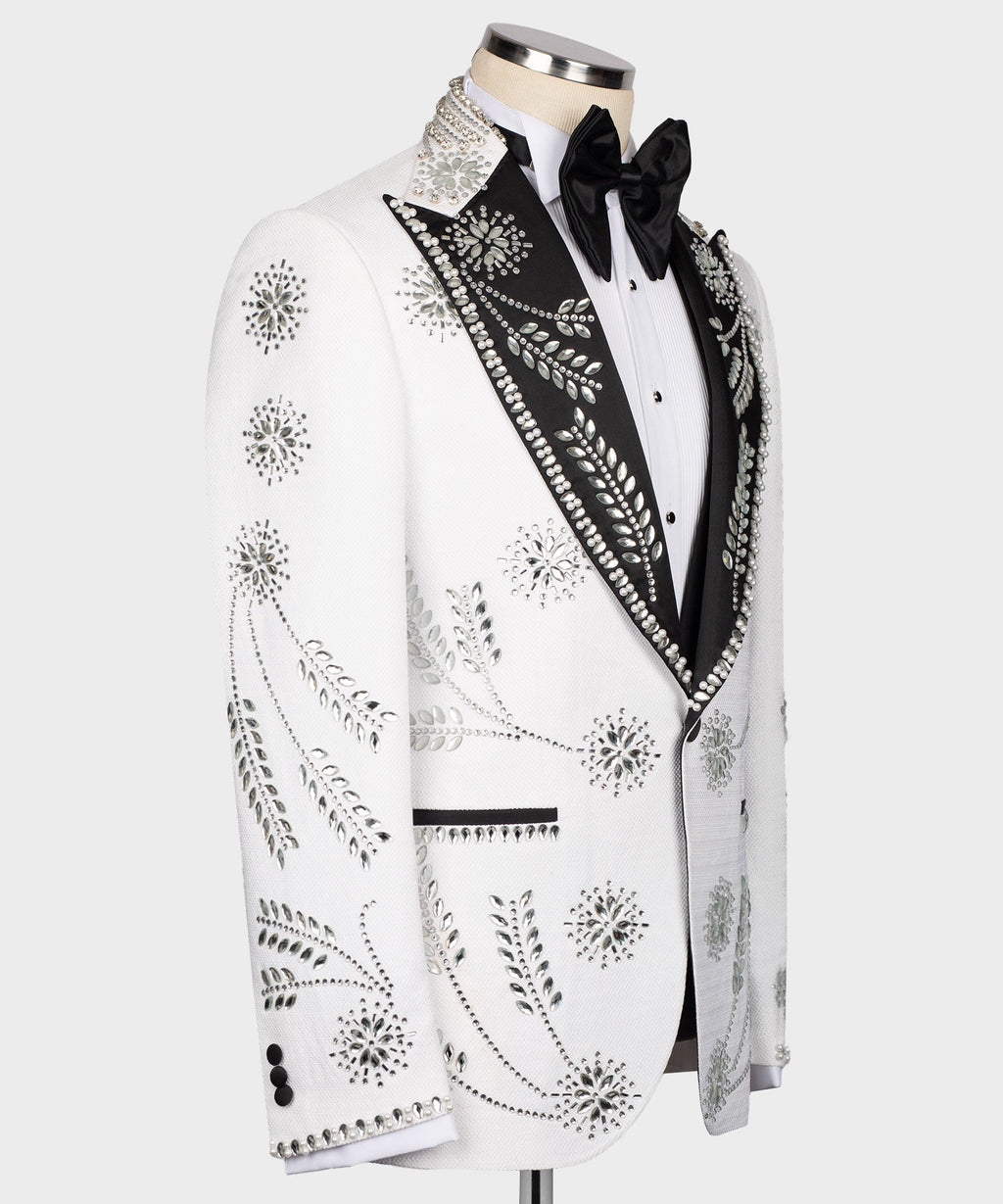 White tuxedo jacket side view with rhinestone floral motifs and jeweled trim lapel