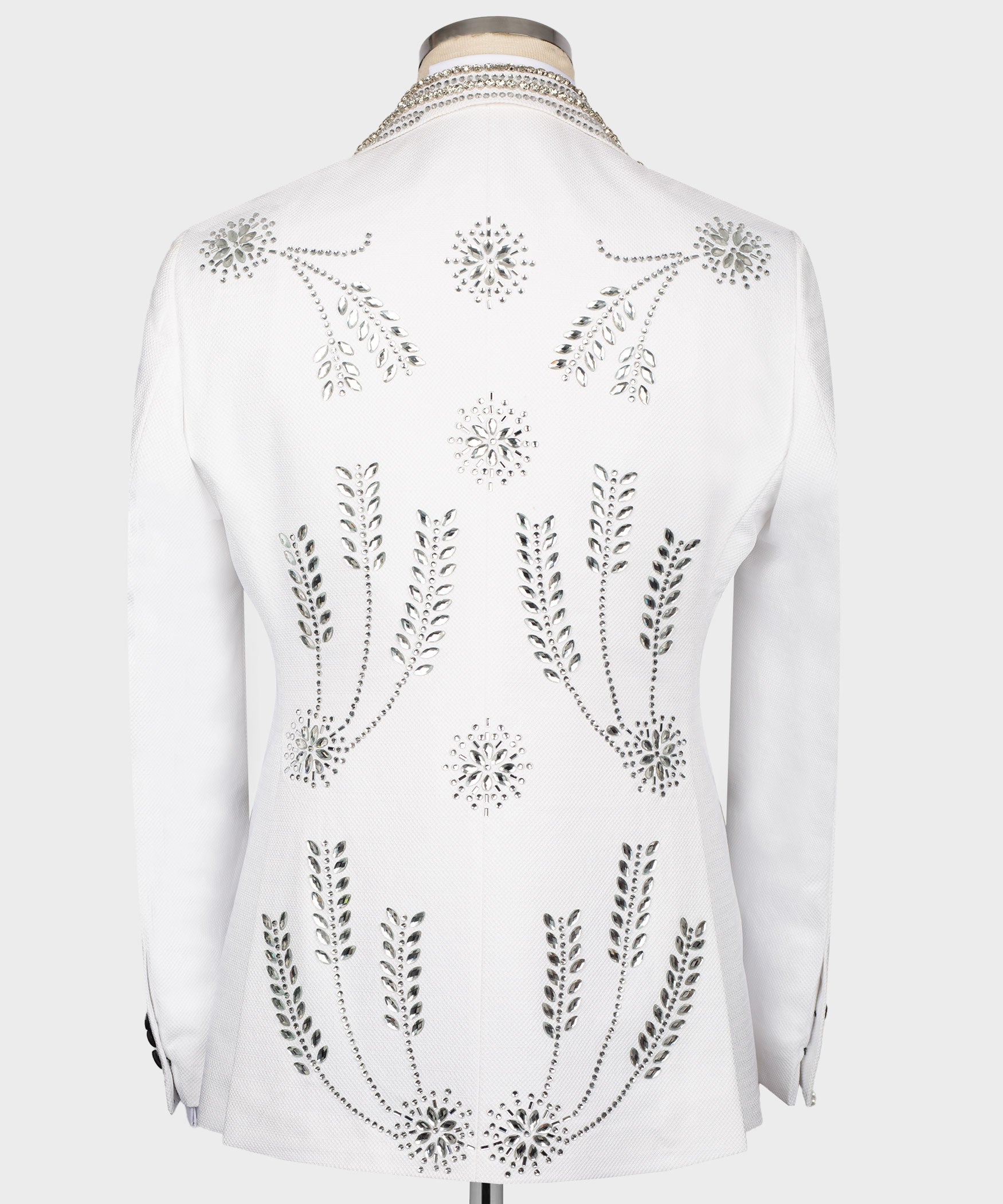 White tuxedo jacket back view with scattered rhinestone floral and leaf motifs