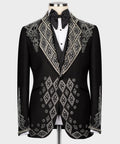 Black tuxedo jacket with rhinestone-embroidered lapels and diamond motif, bow tie