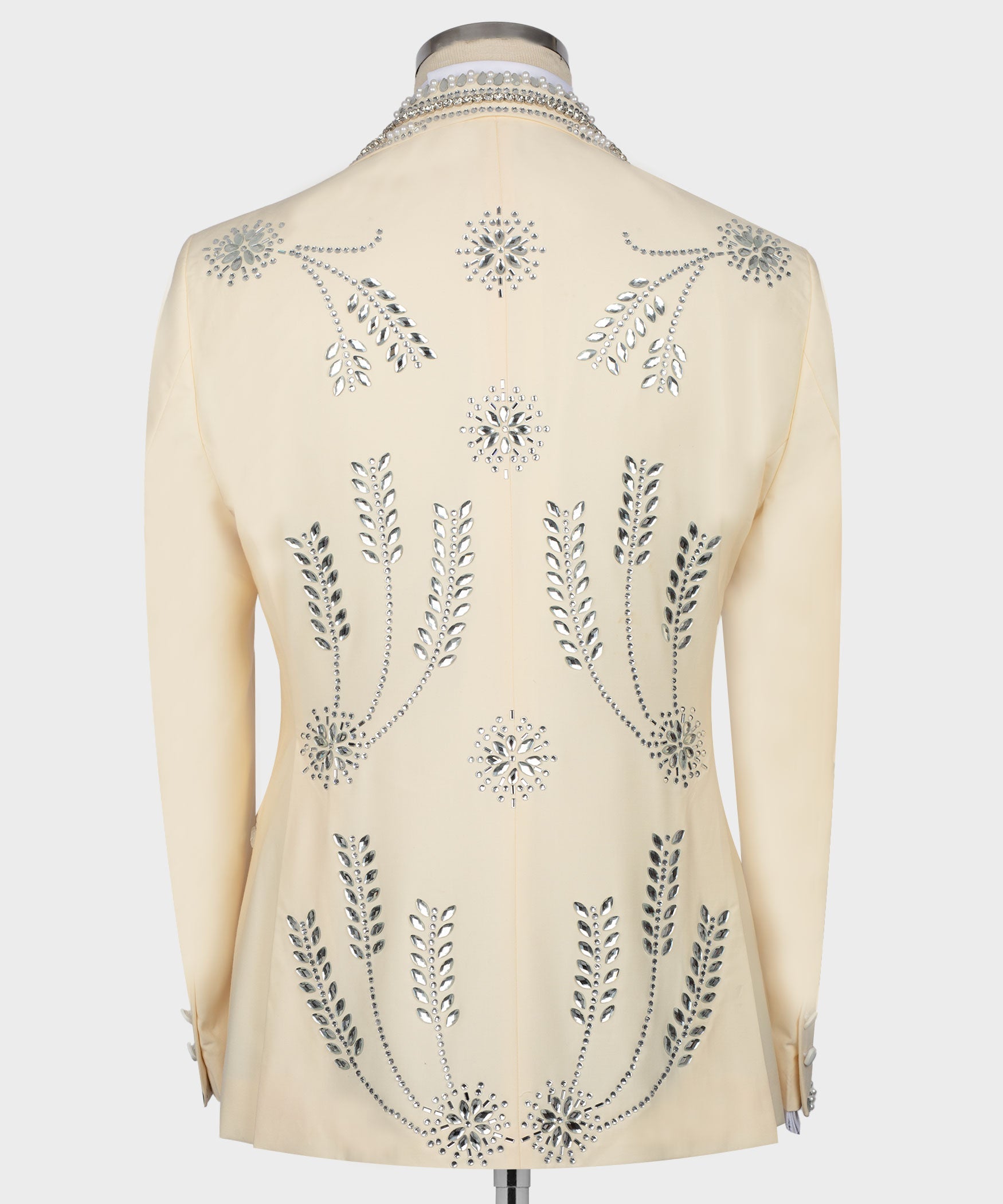 Cream tuxedo jacket back view with gemstone embroidered florals and trailing vine design