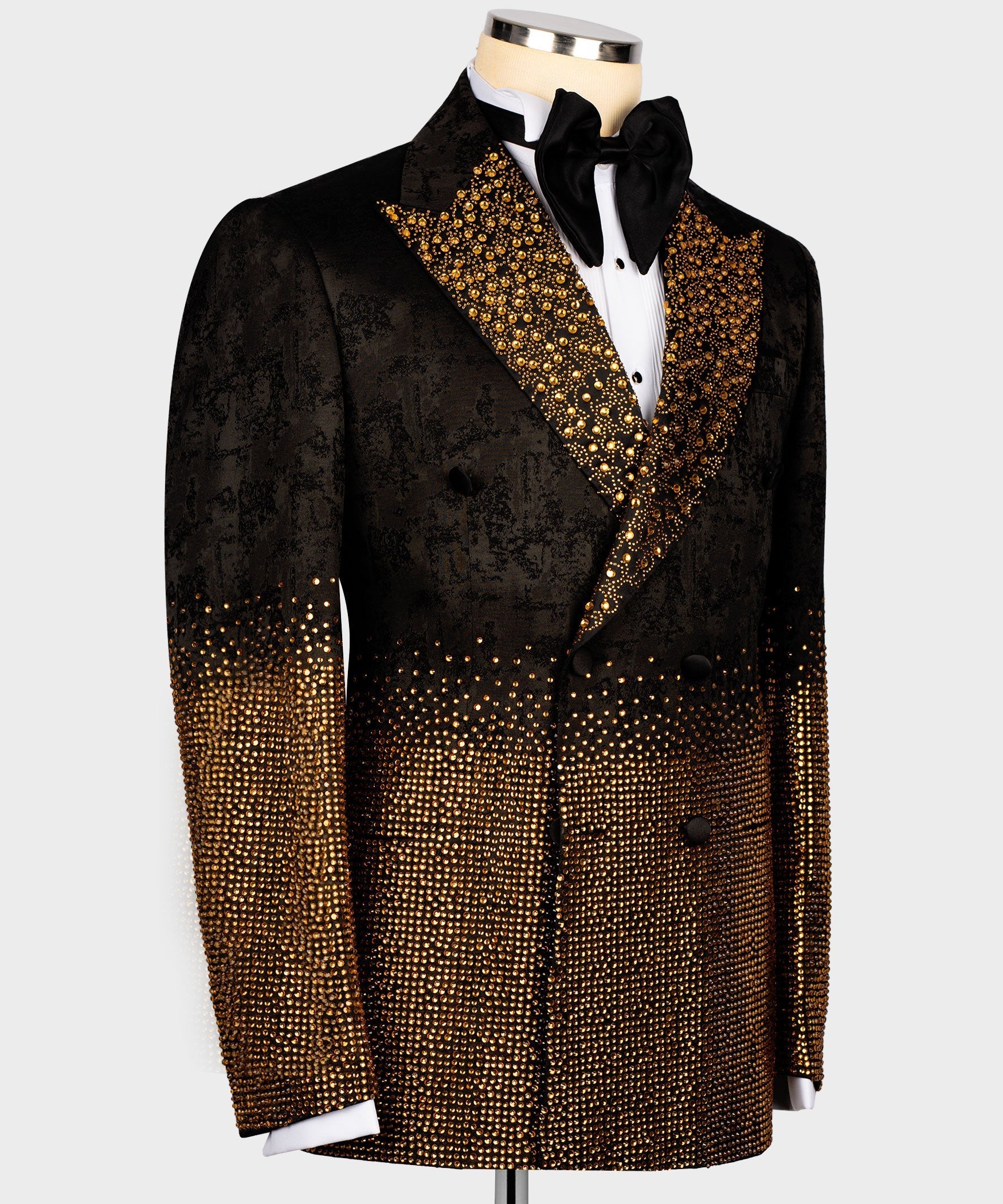 Black tuxedo jacket with gold crystal trim at shoulders, cuffs, and front hem