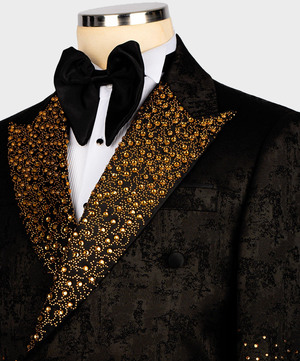 Close-up: black tuxedo lapel with gold gemstone embroidery and black bow tie
