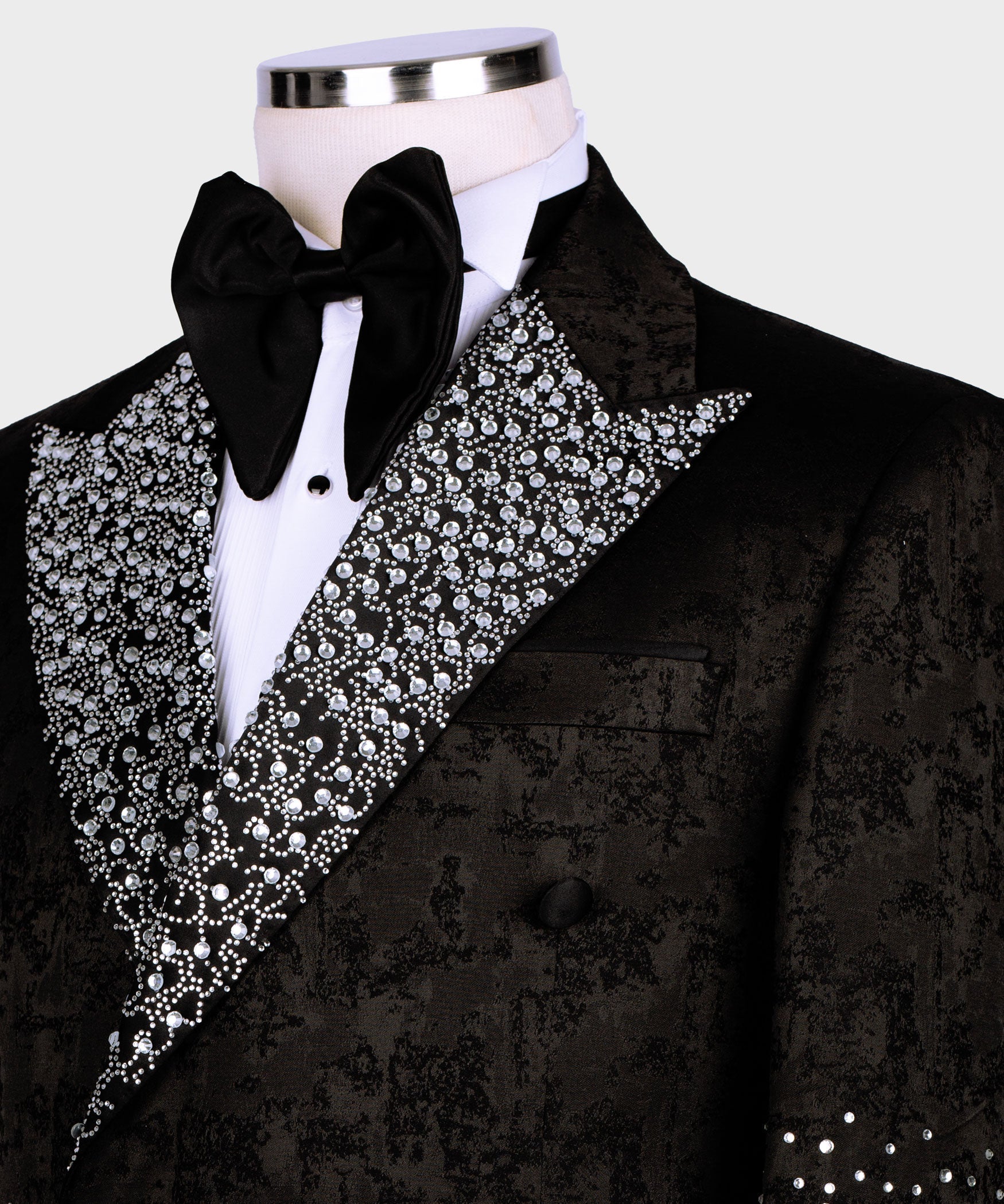Black tuxedo lapels with silver gemstone embroidery and black satin bow tie