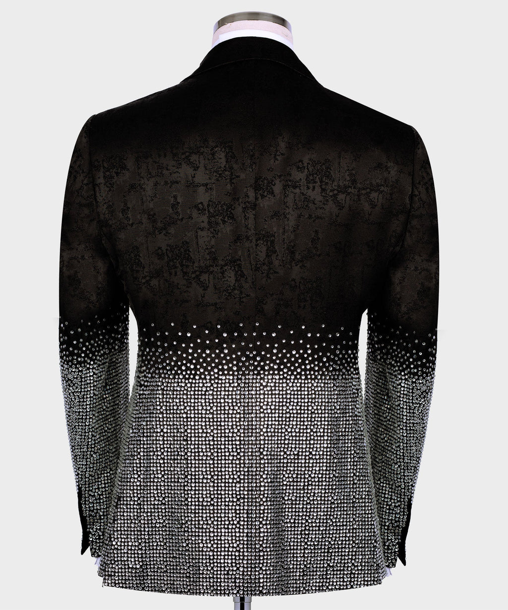 Black tuxedo jacket back view with silver rhinestone detailing at the hem