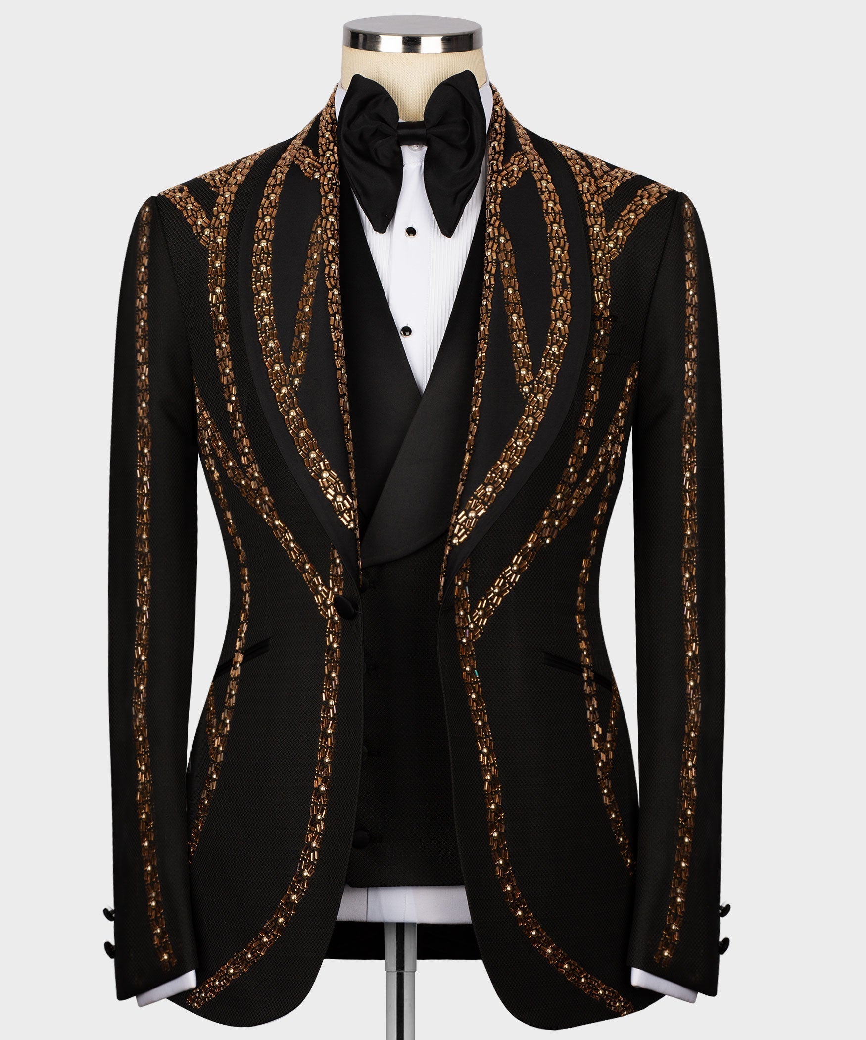 Black tuxedo jacket with gold embroidered curved stripes, bow tie and satin lapels