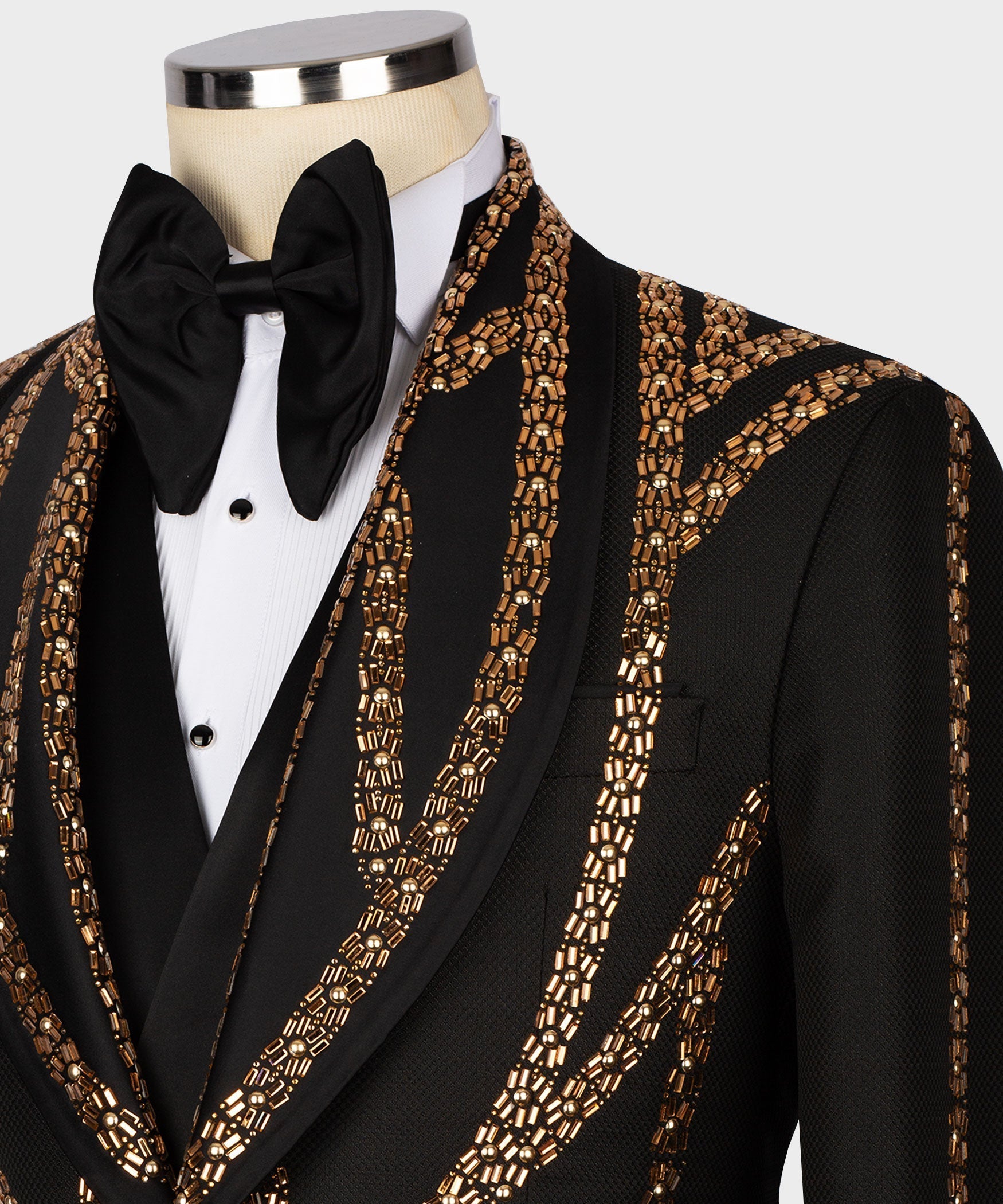 Gold beaded embroidery on black tuxedo lapel with bow tie and shirtfront