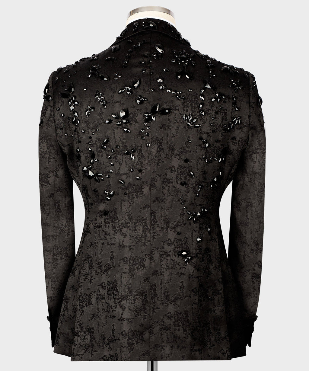 Back view of black tuxedo jacket with jeweled gemstone embroidery across shoulders