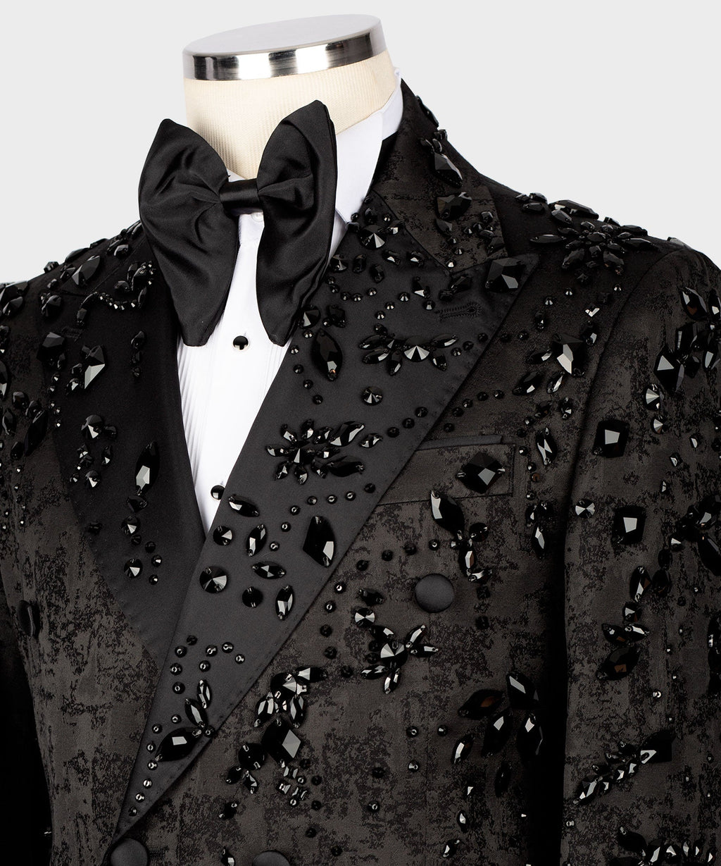 Black tuxedo jacket detail: satin bow tie and jeweled cluster embroidery