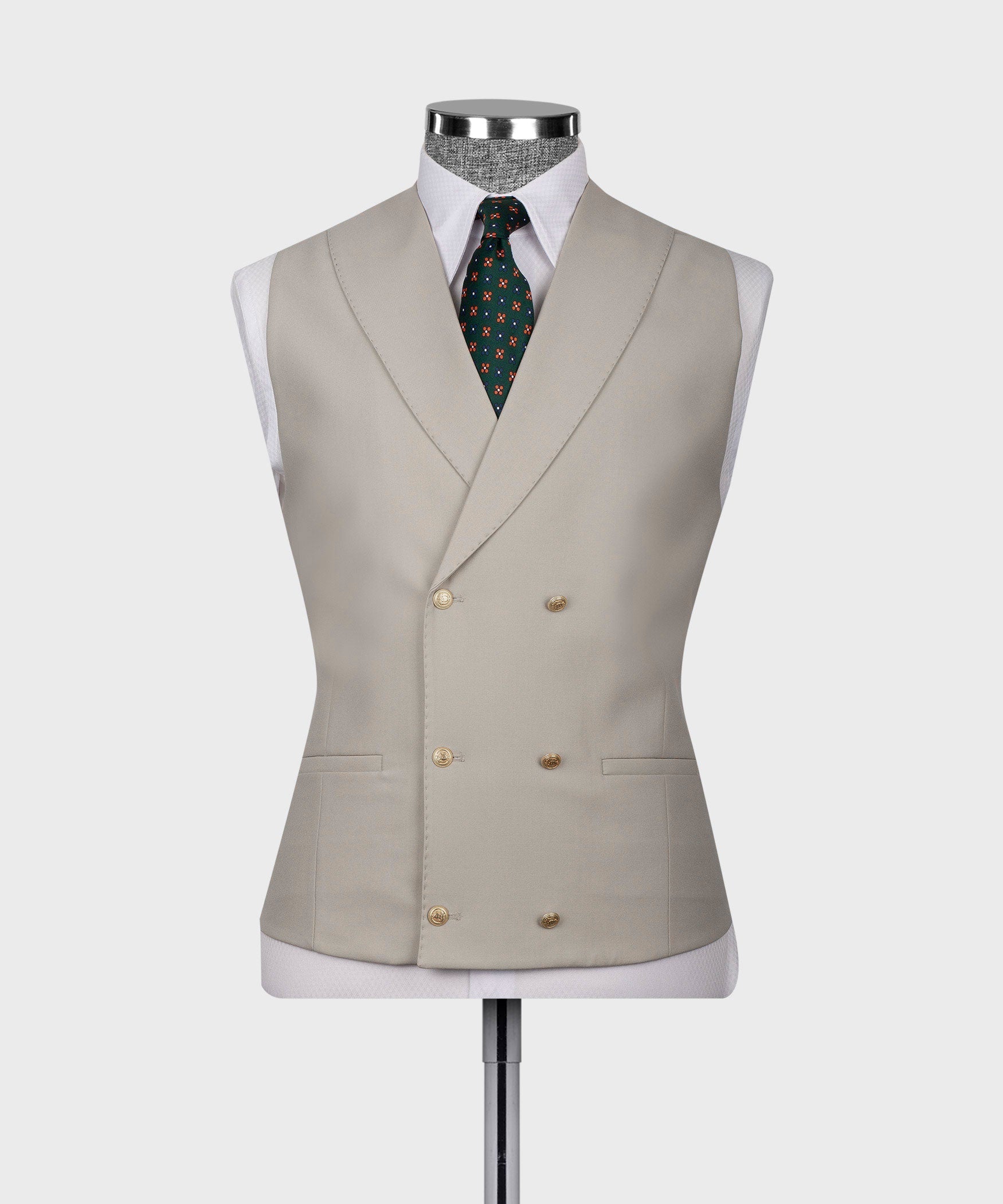 Light taupe waistcoat on mannequin with patterned tie and gold-tone button closures