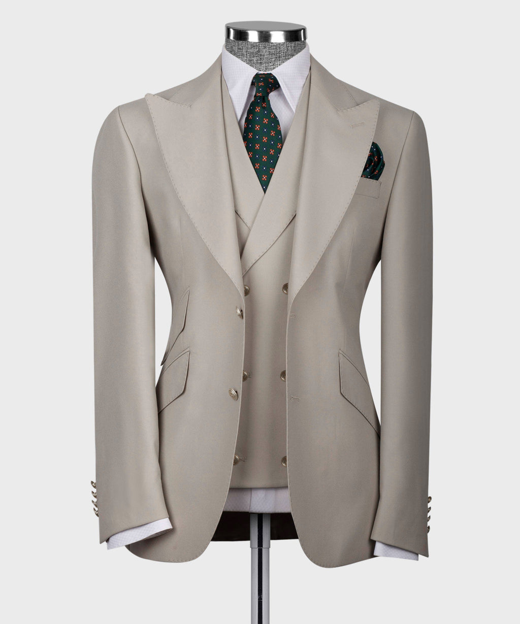 Light taupe three-piece formal vest suit with patterned tie and matching pocket square