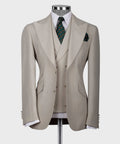 Light taupe three-piece formal vest suit with patterned tie and matching pocket square