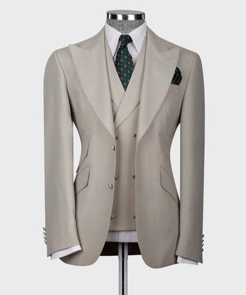 Light taupe three-piece formal vest suit with patterned tie and matching pocket square