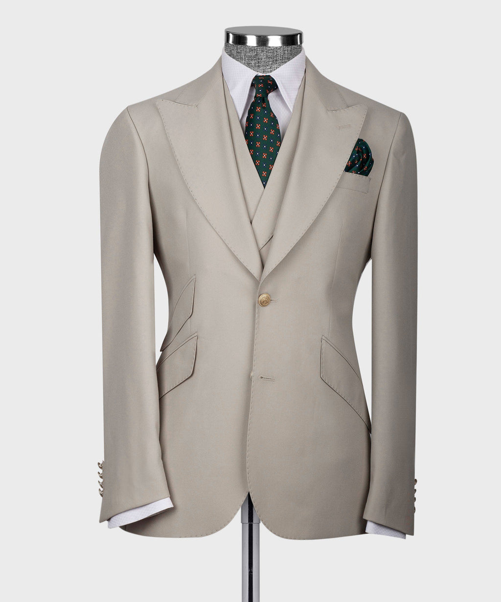 Light taupe suit jacket with vest and patterned necktie; front buttons visible