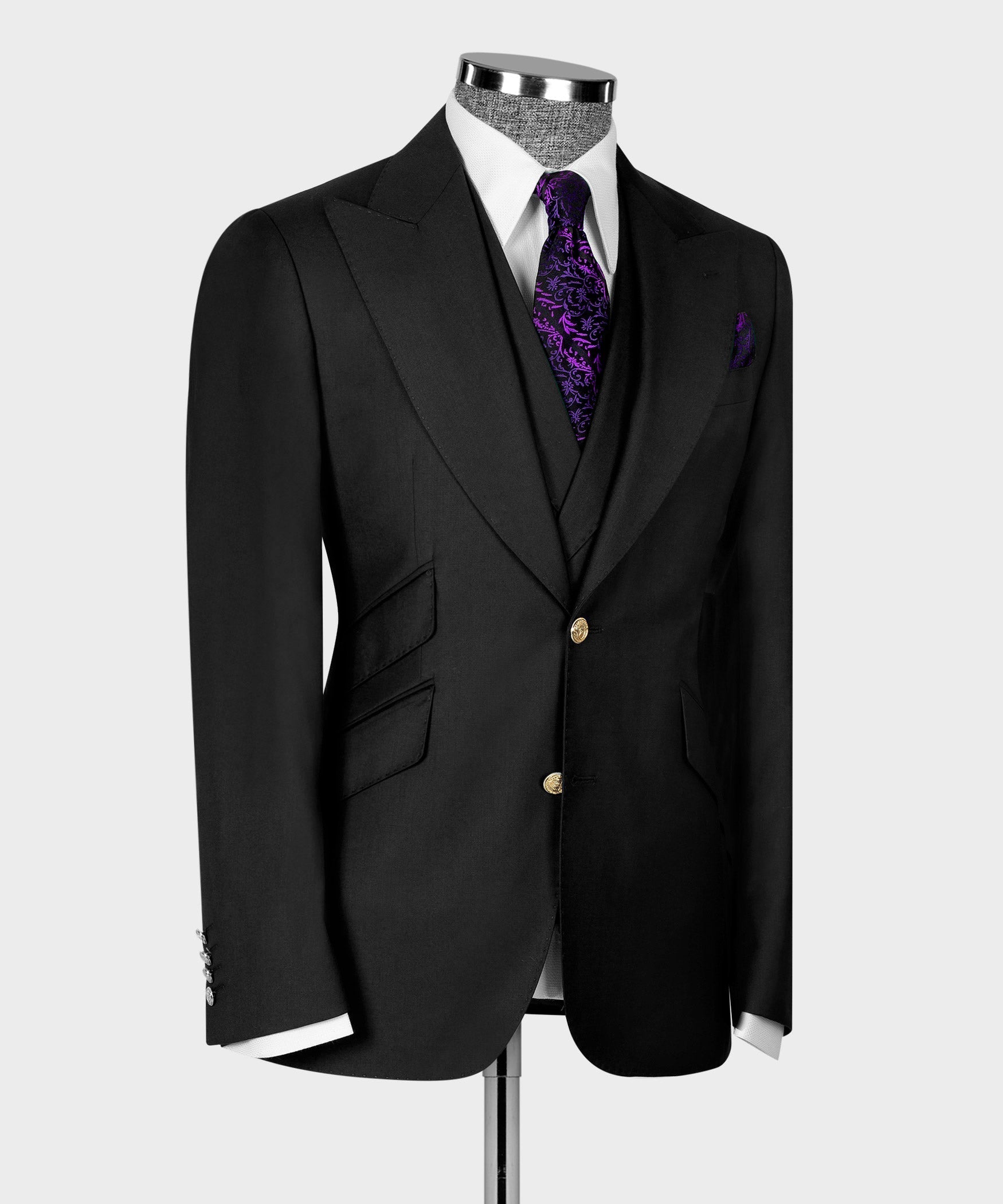 Black tuxedo-style vest and jacket, gold center buttons, purple patterned tie and pocket square