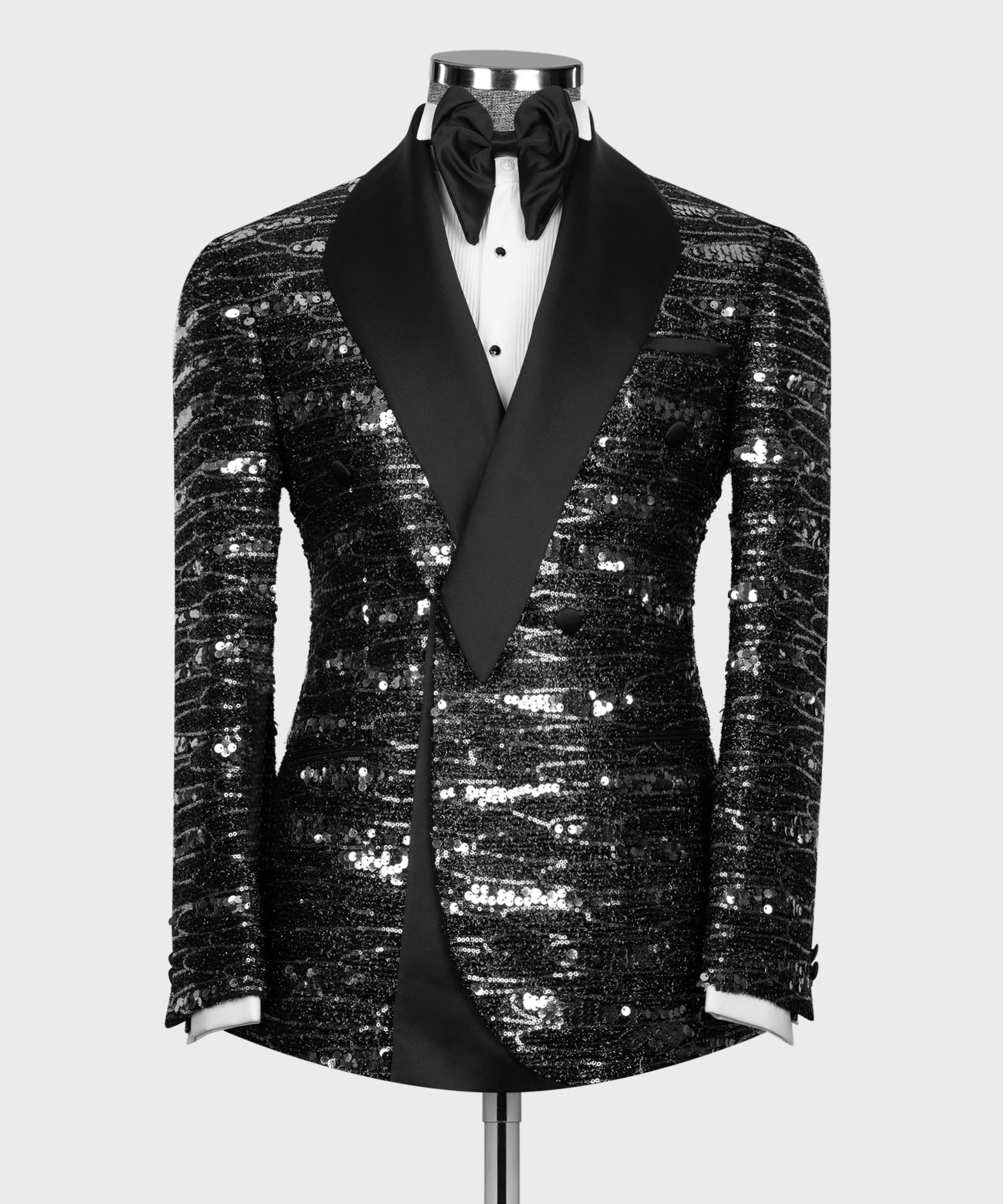 Black double-breasted tuxedo jacket with satin shawl collar, sequined texture, bow tie
