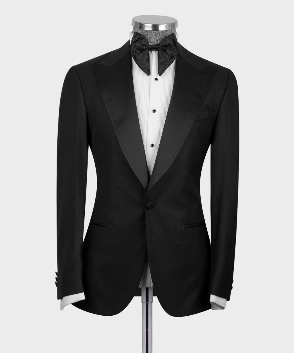 Black tuxedo blazer and waistcoat with bow tie; single-breast front, covered buttons