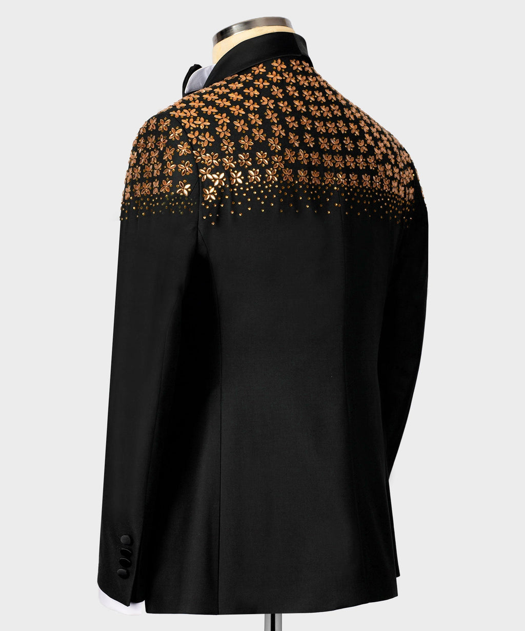 Black tuxedo jacket, back view, gold floral embellishment across upper yoke.