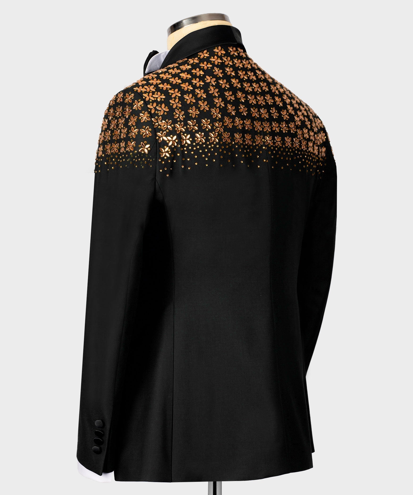 Black tuxedo jacket, back view, gold floral embellishment across upper yoke.