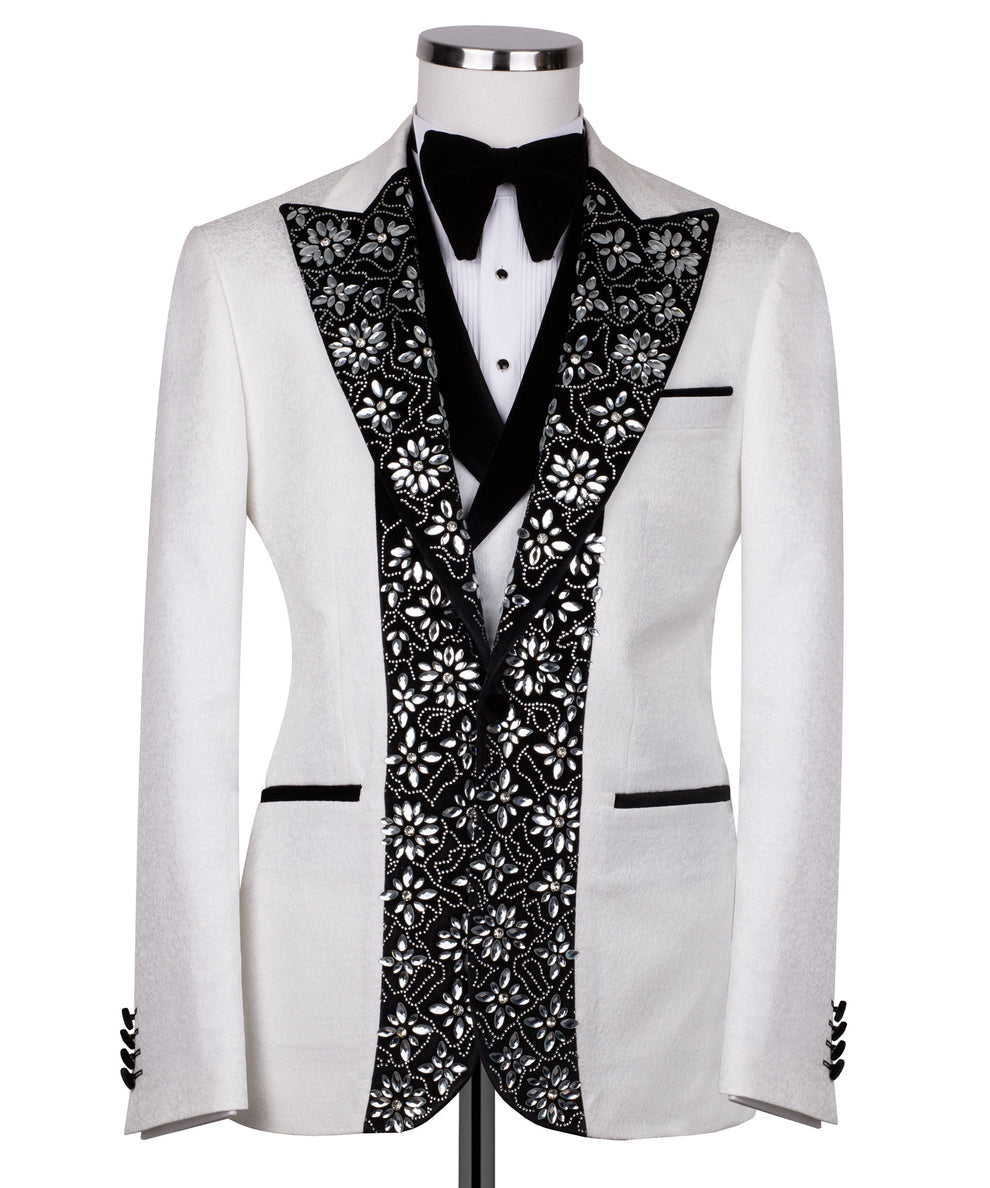 White tuxedo jacket with black stone-embroidered satin lapels and bow tie
