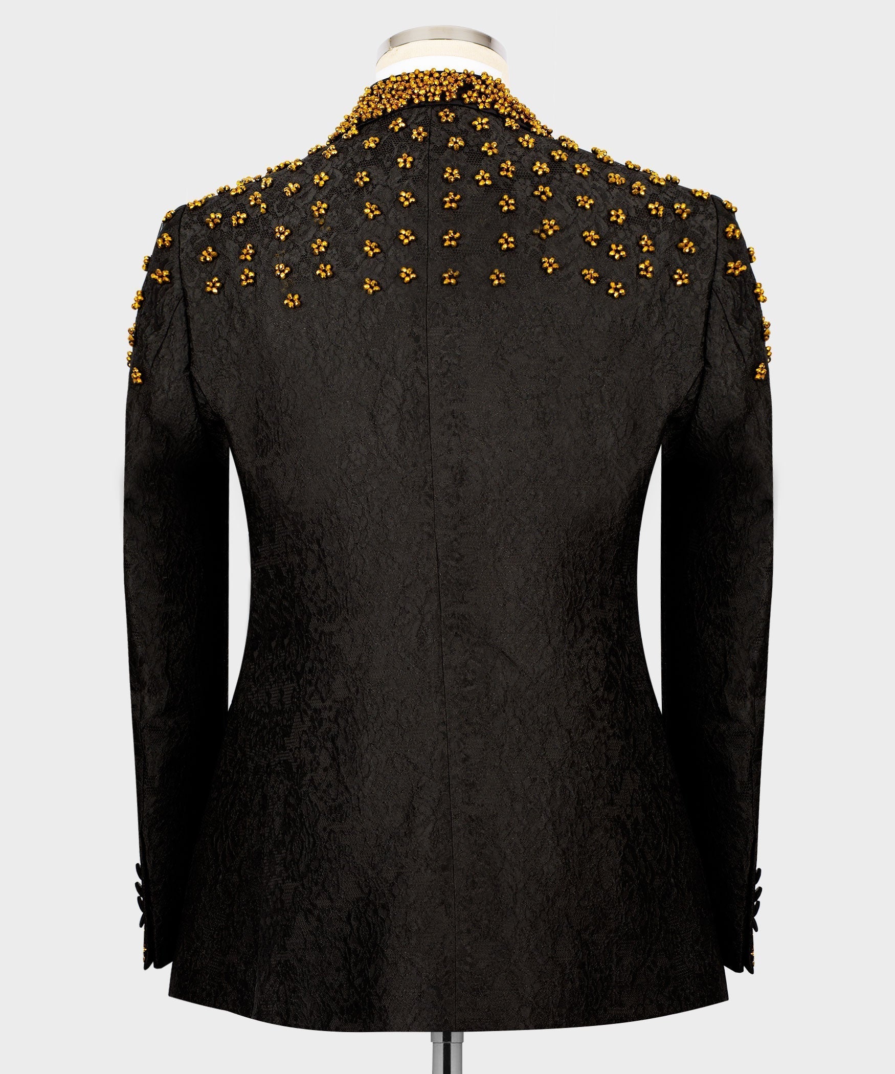 Black tuxedo jacket back view with dense gold bead floral embroidery across shoulders