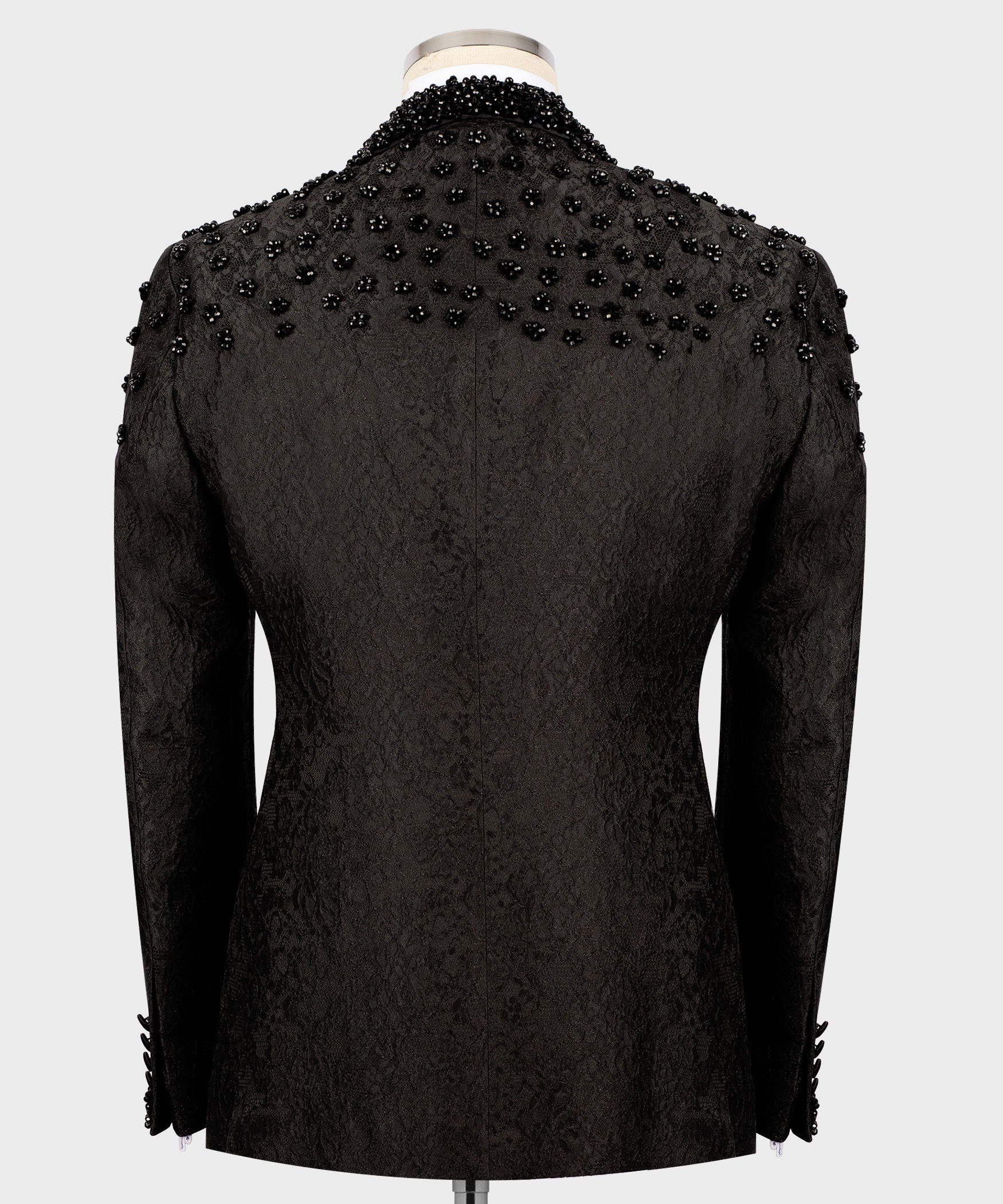 Back view of black tuxedo jacket with allover sequin embroidery, tailored seams