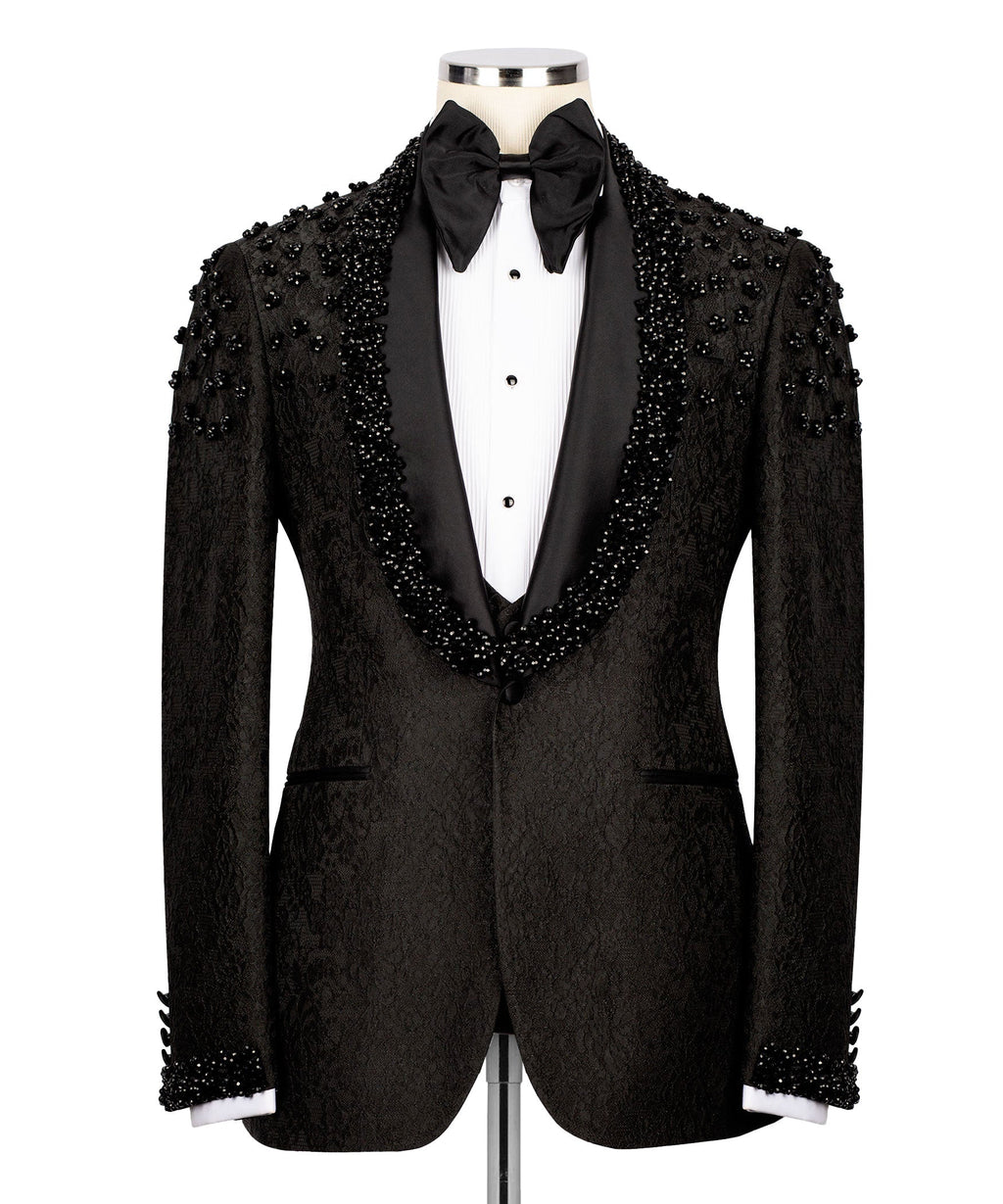 Black tuxedo jacket with beaded sequin embroidery, black bow tie and white vest