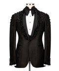 Black tuxedo jacket with beaded sequin embroidery, black bow tie and white vest