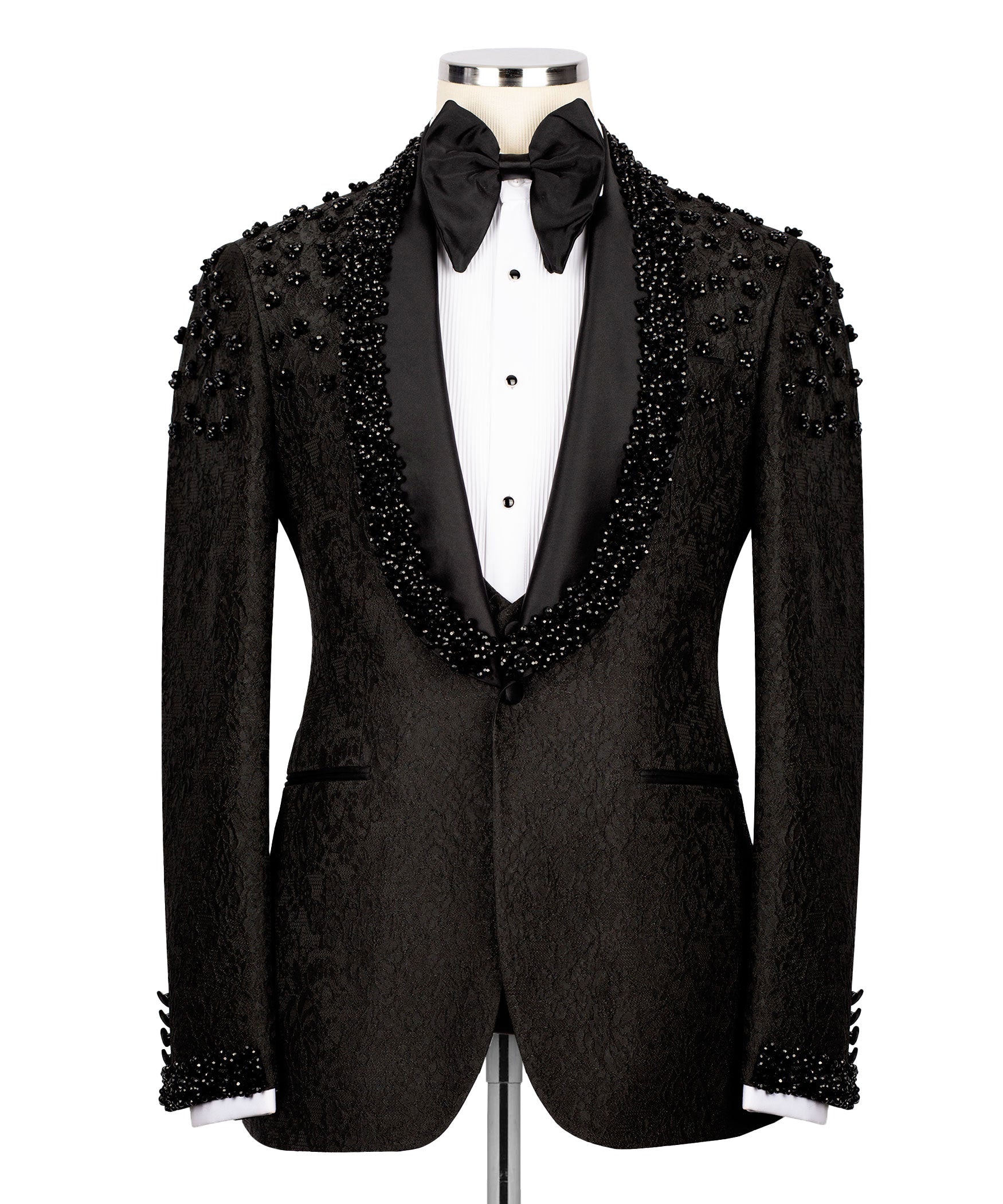 Black tuxedo jacket with beaded sequin embroidery, black bow tie and white vest