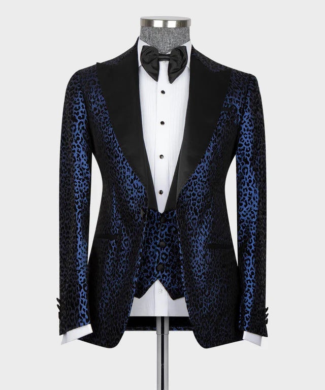 Black tuxedo with blue leopard print sleeves on a mannequin against a white background