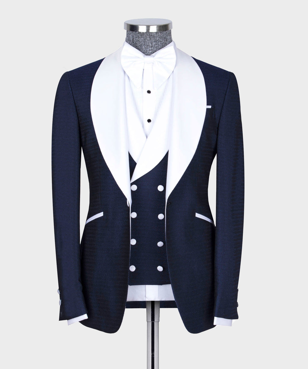 Classic tuxedo suit with navy jacket and waistcoat, white dress shirt, bow tie