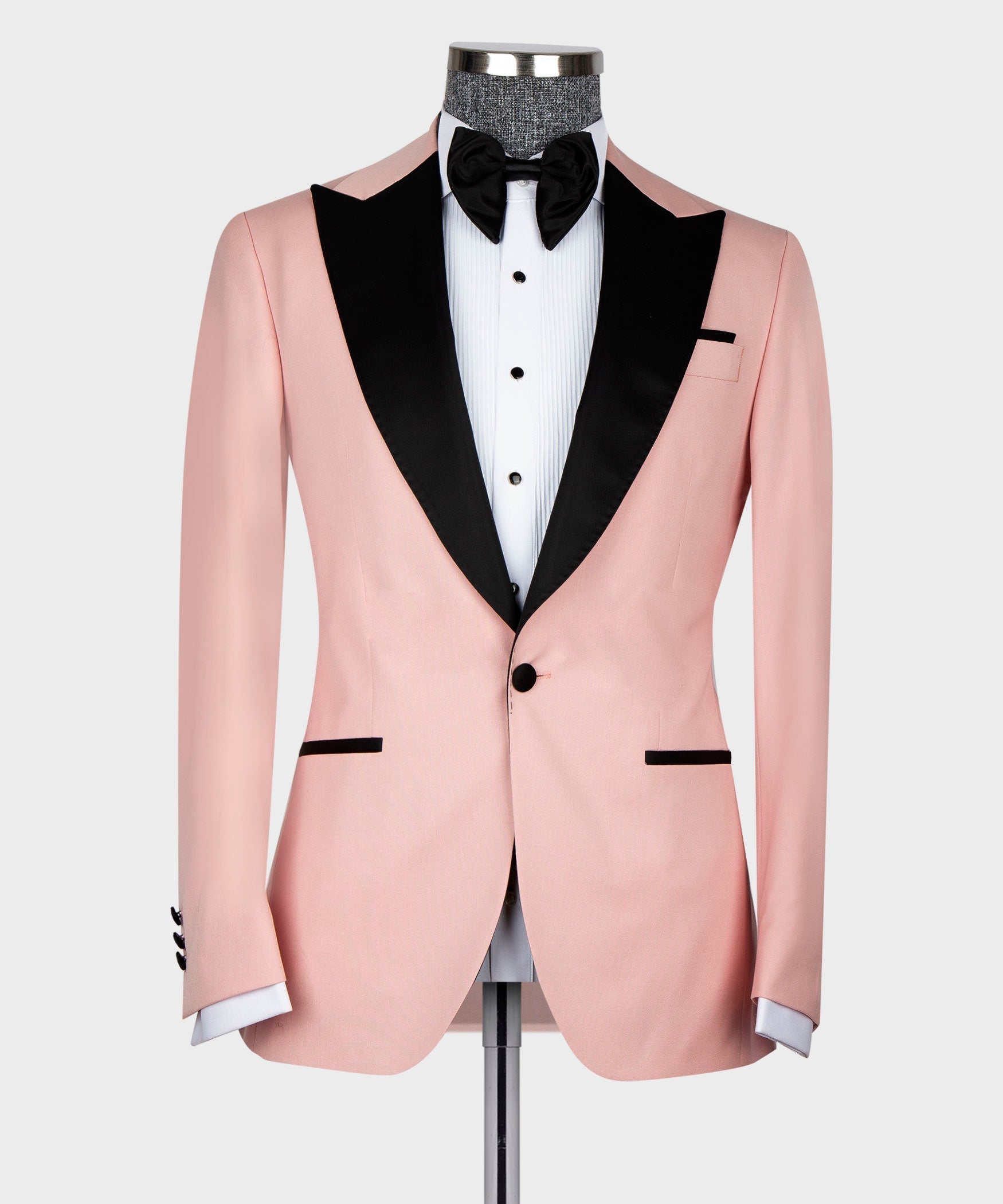 Pink tuxedo jacket with black lapel trim and buttoned front, straight-on view