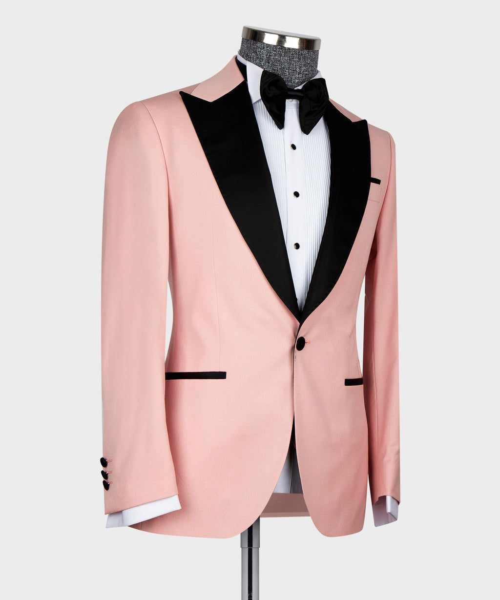 Pink tuxedo jacket with black lapels and black bow tie, side angle on mannequin