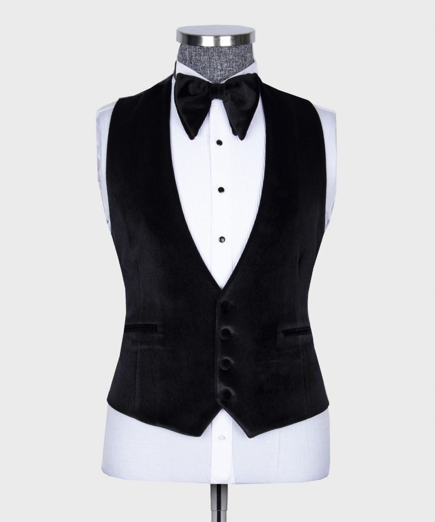 Black velvet tuxedo vest and jacket front with bow tie and white dress shirt