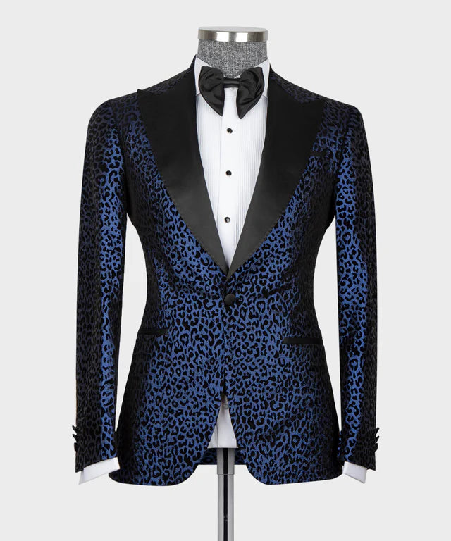 Black tuxedo with blue leopard print pattern on a mannequin against a white background