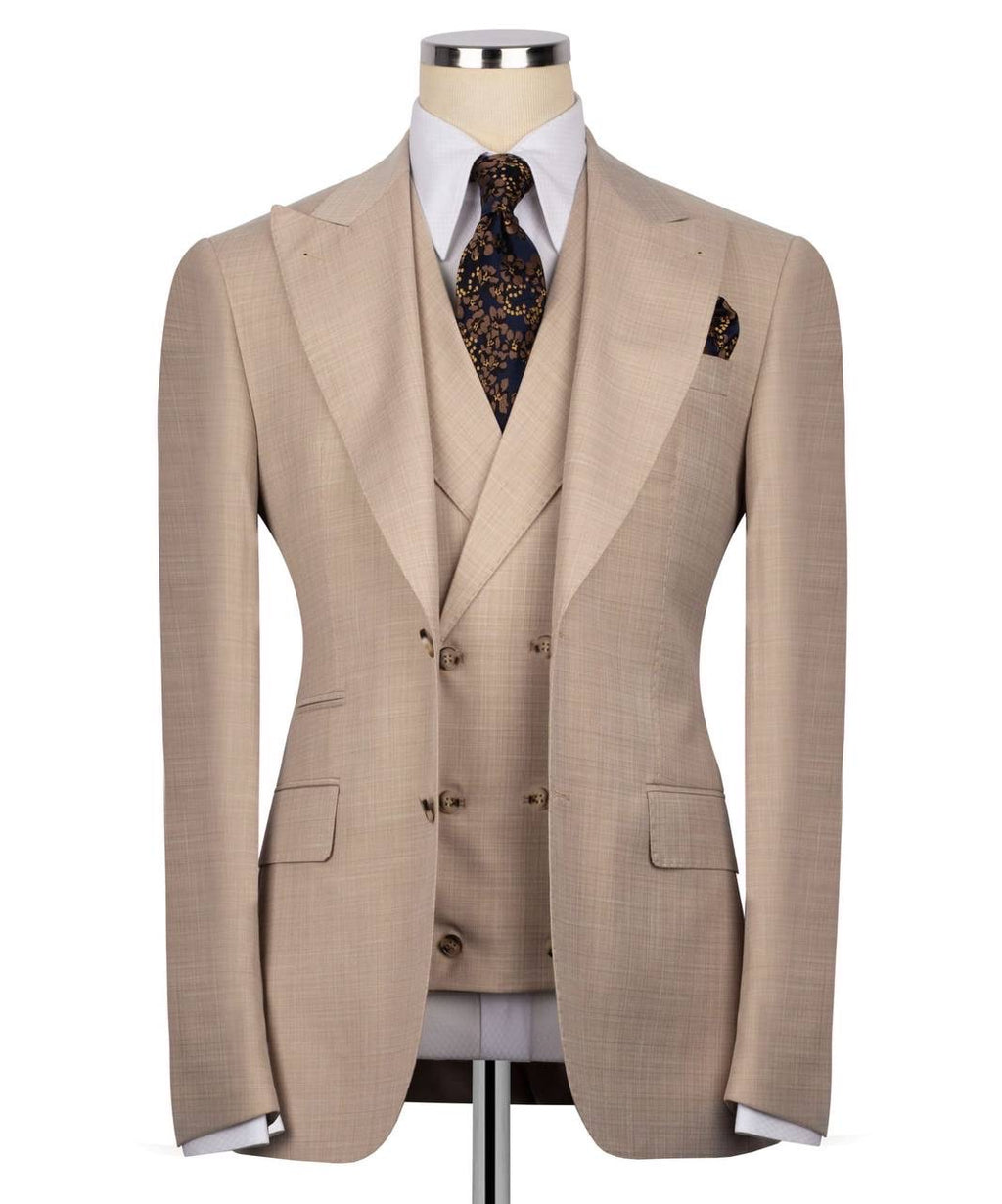 Beige suit on a mannequin with a white shirt and patterned tie