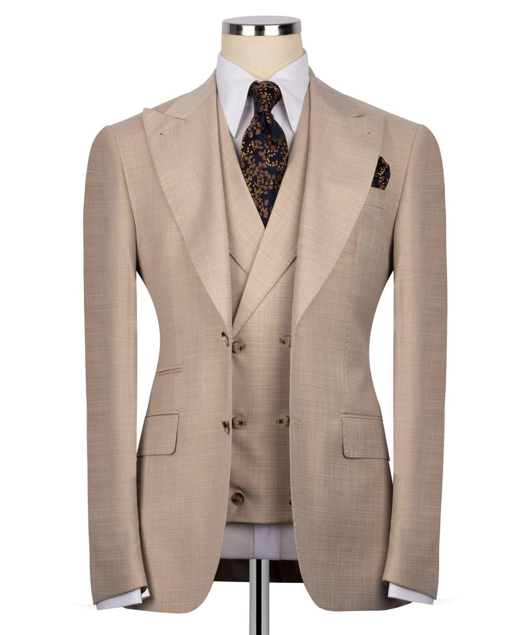 Beige suit on a mannequin with a white shirt and patterned tie