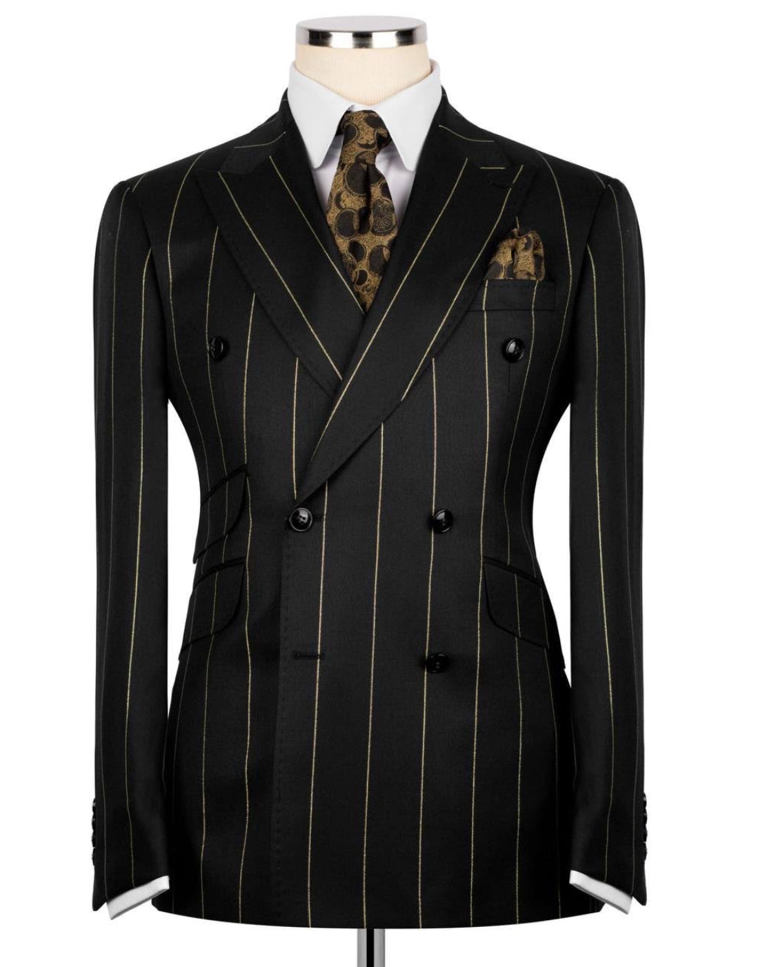 Black pinstripe suit on a mannequin with a white shirt and patterned tie.