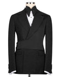 Black formal jacket with white shirt and bow tie on a mannequin against a white background
