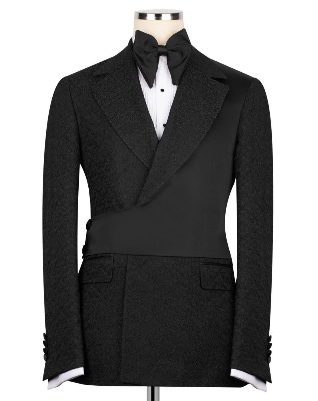Black formal jacket with white shirt and bow tie on a mannequin against a white background