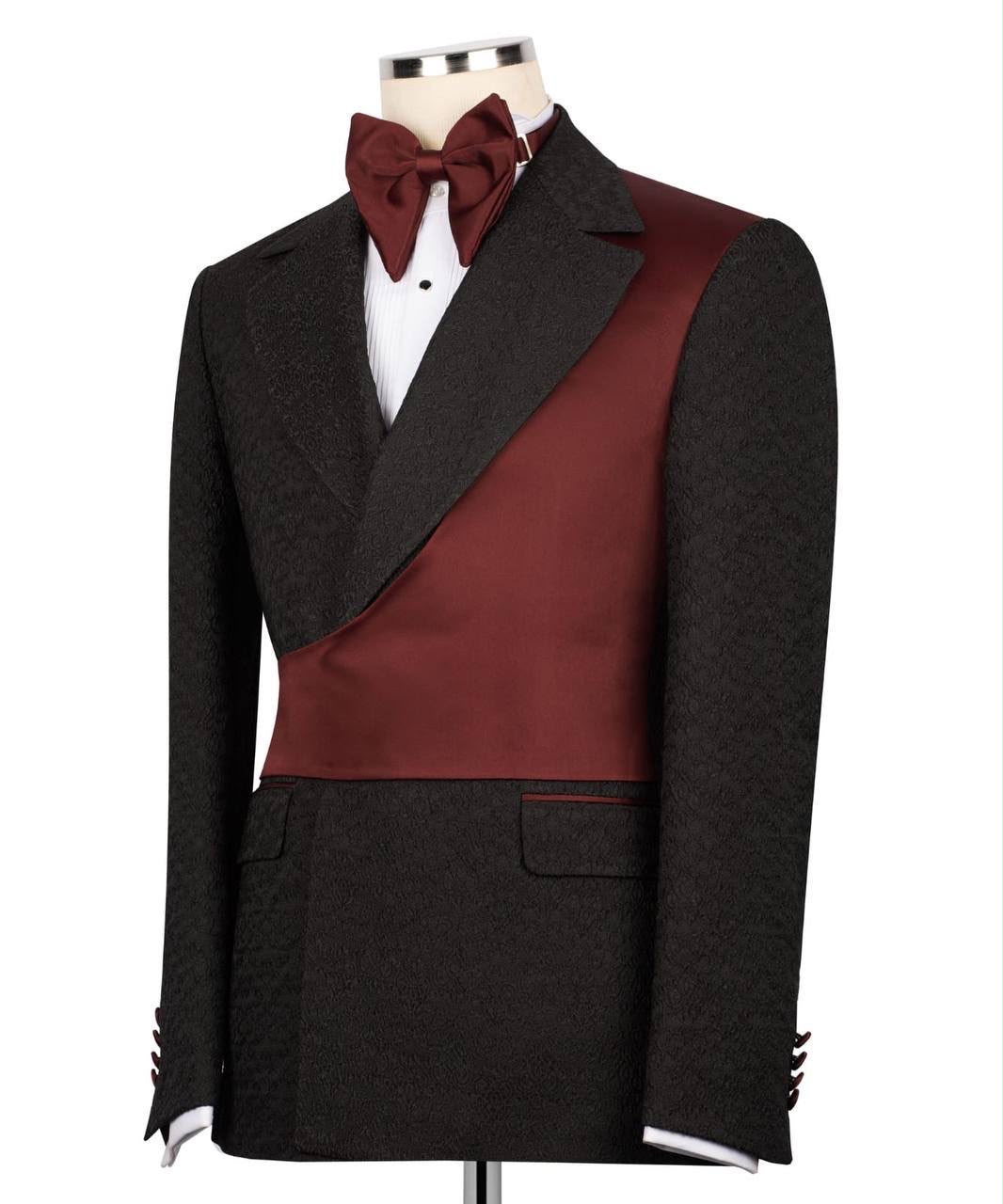 Black tuxedo with red vest and bow tie on a mannequin