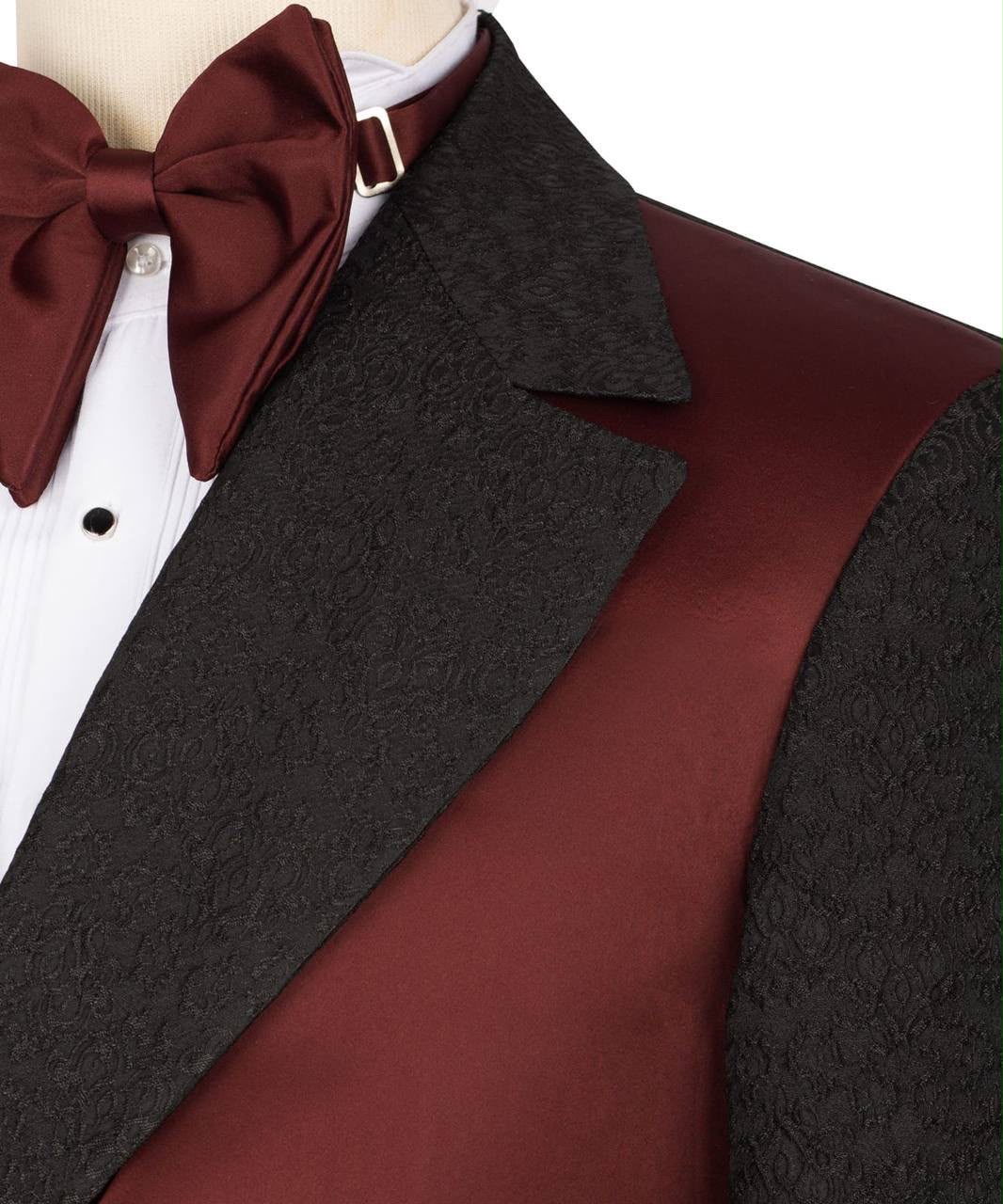 Close-up of a formal outfit with a dark gray jacket, red vest, and bow tie