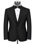 A black tuxedo jacket displayed on a mannequin torso with a white dress shirt, black bow tie, and black patterned inner shawl collar, against a light gray studio background.