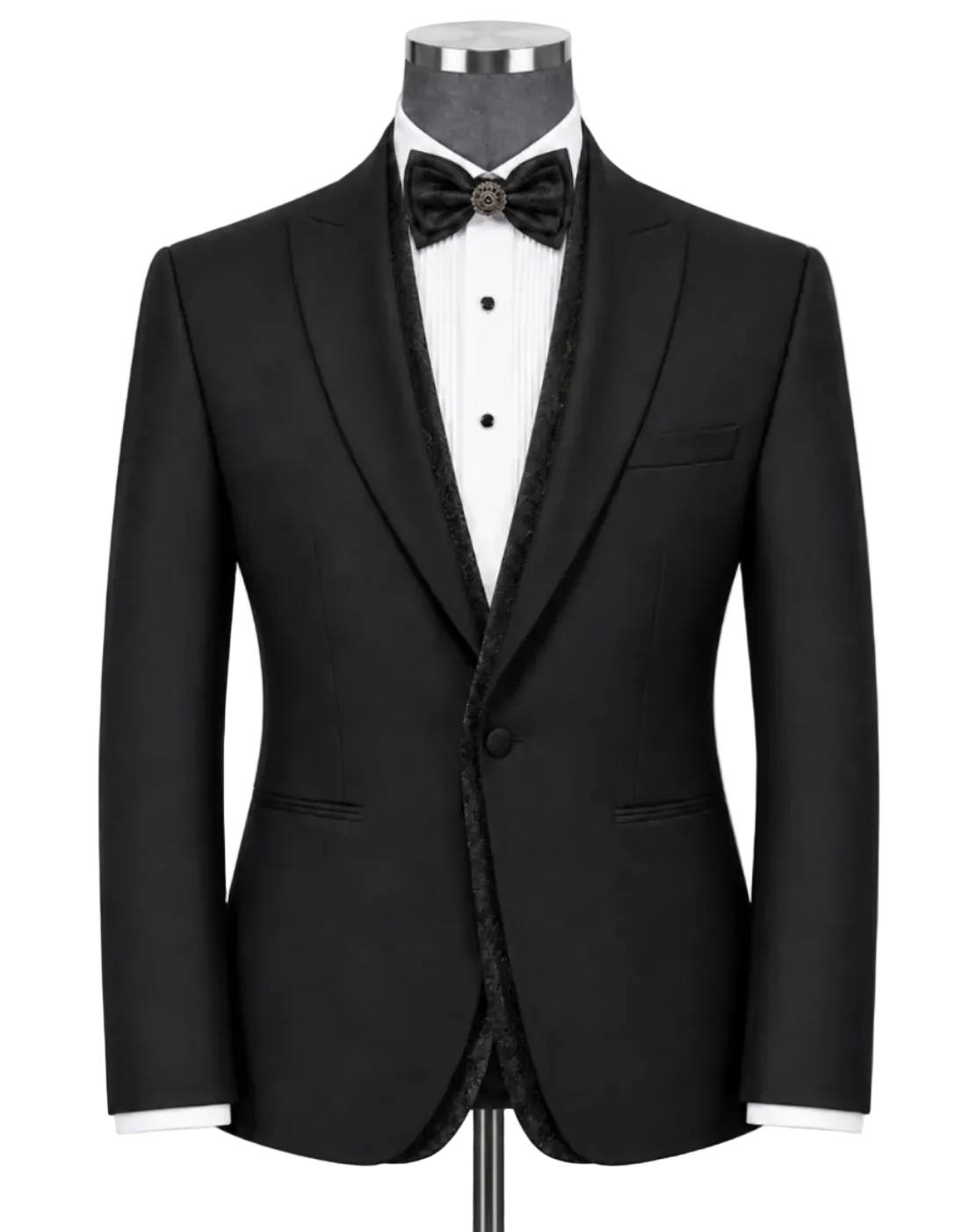 A black tuxedo jacket displayed on a mannequin torso with a white dress shirt, black bow tie, and black patterned inner shawl collar, against a light gray studio background.