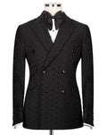 A black double-breasted tuxedo jacket embellished with small silver studs, displayed on a mannequin with a black bow tie and white shirt.