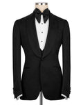 Black tuxedo jacket on a mannequin with a white shirt and bow tie