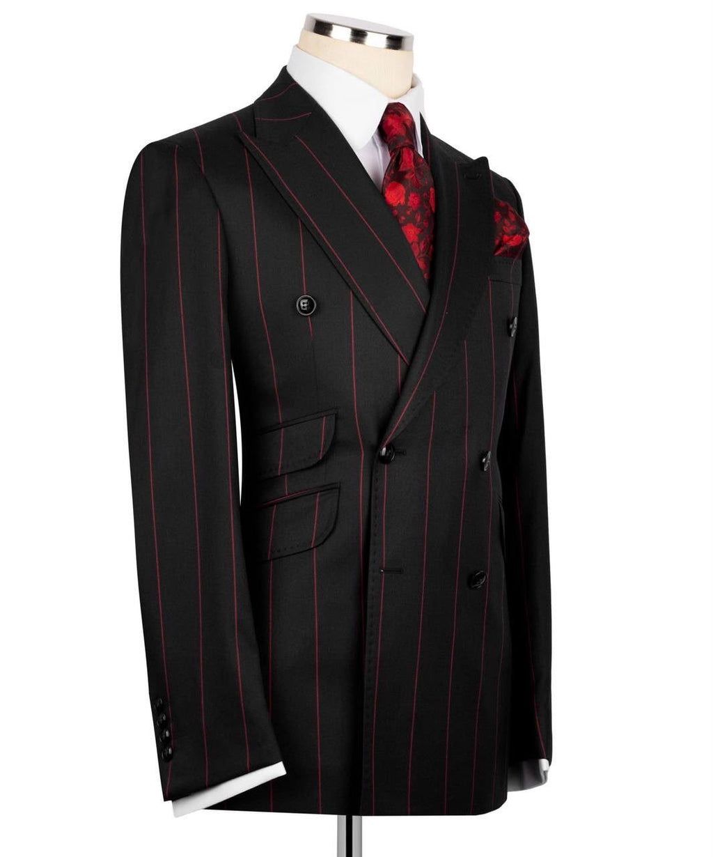 Black pinstripe suit with a red patterned tie on a mannequin 